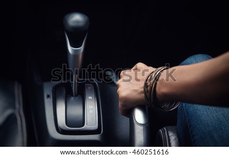 Image of pulling handbrake on the car,focuson hand