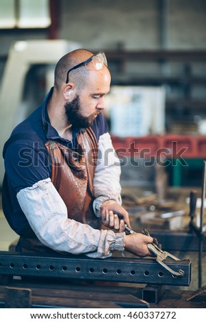 Worker using hand clamp