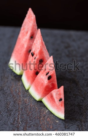 sliced watermelon close-up on a dark background