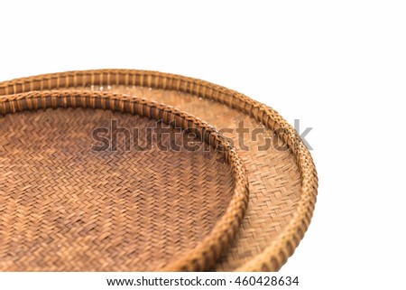 The handmade  wooden basket is good quality put on a white background.
