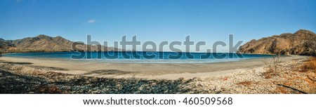 Panoramic shot of a beach at Blanca beach in Guanacaste, Costa Rica Royalty-Free Stock Photo #460509568