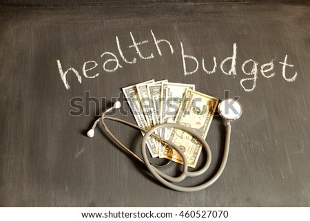Health care concept and finance concept on blackboard. This photo can use as medical concept. 