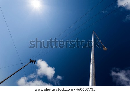Electric pole with beautiful blue sky.