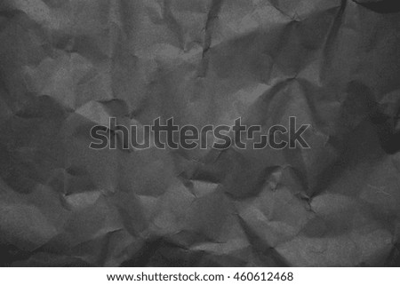 Black creased paper background texture