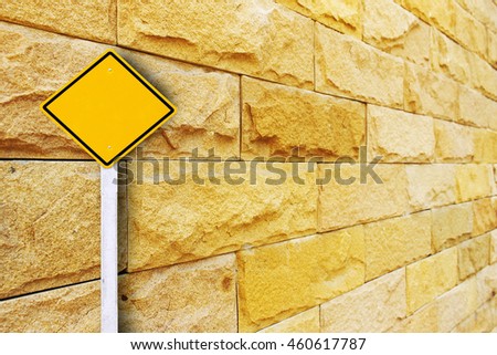 traffic sign post on  blur brick wall in perspective background