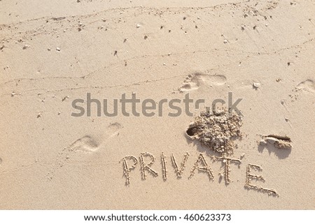 written words "PRIVATE" on sand of beach