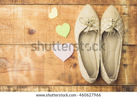 girl shoes over wooden deck floor. Vintage effect filter style pictures.