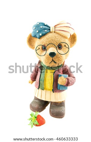Cute teddy bear Wear glasses and strawberry on floor
isolate on white background with copy space - ceramic Teddy Bears.