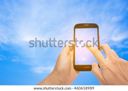 Screen smartphone with space for copy on a sky and sunshine background.