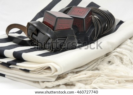 Cutout of Tifillin and Talit on white background Royalty-Free Stock Photo #460727740