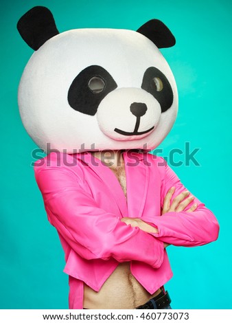 A guy in a pink tailcoat with a panda head. On the bright background.