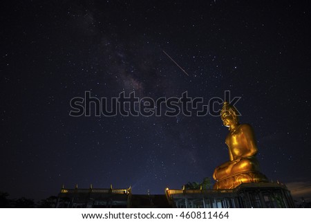 Milky Way over Buddha statue in Thailand,long explosure photography,Background blur and sofe focus