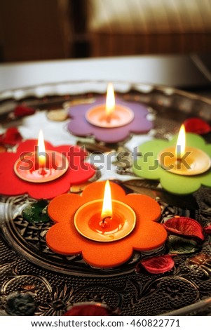 floating little candles in glass water bowl.
