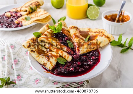 Crepes with berries and homemade caramel, simple and delicious breafast