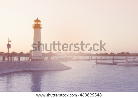 blurry picture of boats pier lighthouse and lake at Rockwall TX for background , filtered color tone