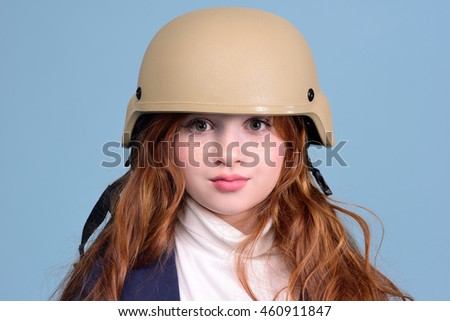 beautiful red-haired girl in a military hat, the concept is not quiet time