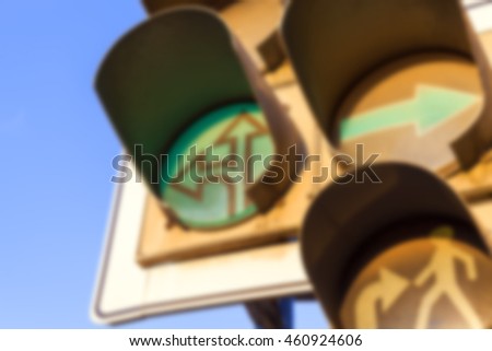   photographed close-up of a   light to regulate traffic at the intersection, defocus