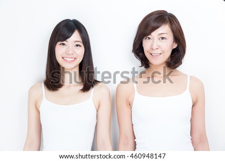 portrait of asian family daughter and mother isolated on white background