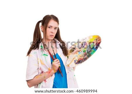 young artist paints a woman and posing on a white background