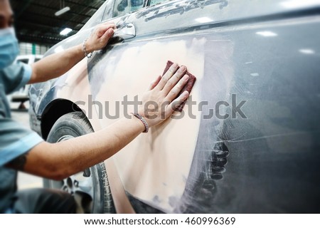 Car body work auto repair paint after the accident during the spraying      automotive                           Royalty-Free Stock Photo #460996369