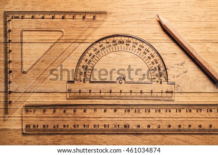 protractor, pen, pencil, rules and workbook page,Beginning design
