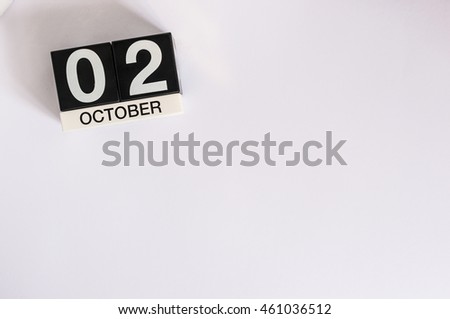 October 2nd. Day 2 of month, wooden color calendar on white background. Autumn concept. Empty space for text