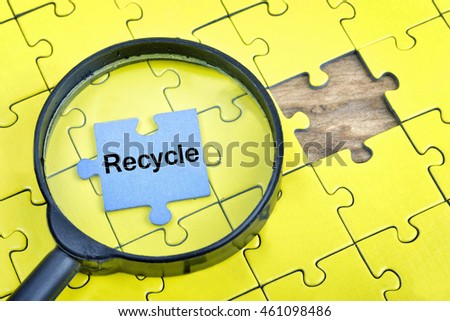 Puzzle pieces with word Recycle