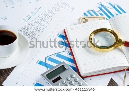 Financial charts and graphs on the table