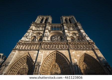 Notre Dame de Paris cathedral against sky, Paris, France. Notre Dame is one of top tourist attractions of Paris. Low angle view of the ornate facade. Beautiful Gothic exterior of the Paris landmark.