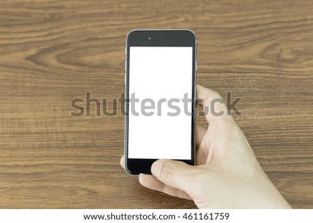 Hand using cell phone white screen on top view
