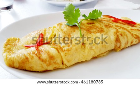 closeup of a plate with a typical tortilla de patatas, spanish omelet, on a set table Royalty-Free Stock Photo #461180785