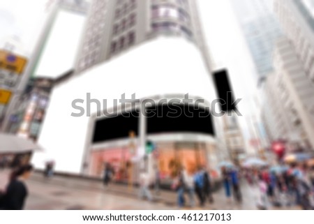 Large billboard Signs for advertisement at the downtown area with blur background of crowded