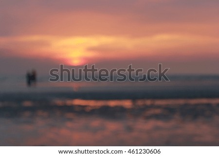 Blur Image - Boy and couple on the sunset beach