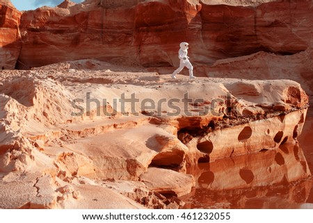 futuristic astronaut on another planet, image with the effect of toning Royalty-Free Stock Photo #461232055