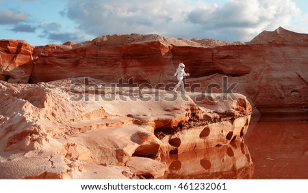futuristic astronaut on another planet, image with the effect of toning Royalty-Free Stock Photo #461232061