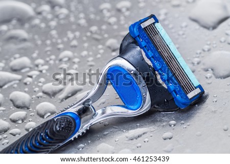 wet disposable razor isolated.closeup Royalty-Free Stock Photo #461253439