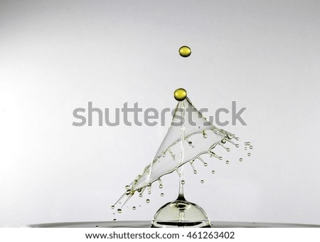 This is a photograph of 2 water droplets colliding 