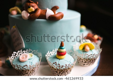 nice teddy bear lying on the cake