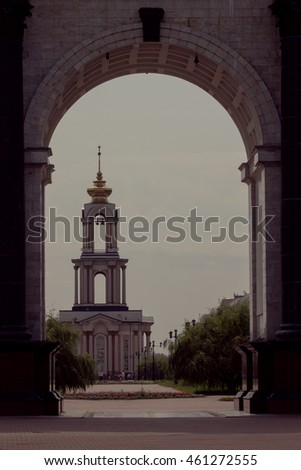 Arch of Triumph, Temple, trees, paved road, grassy lawn Royalty-Free Stock Photo #461272555