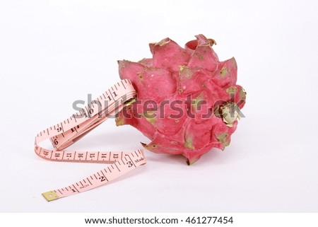 Delicious red dragon fruit with measuring tape
