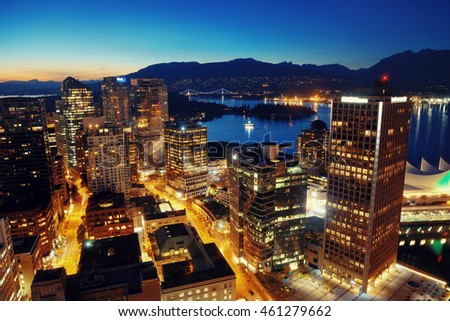 Vancouver rooftop view with urban architectures at dusk.
