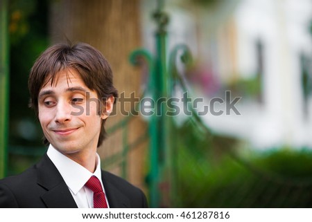 A picture of a funny man in red tie