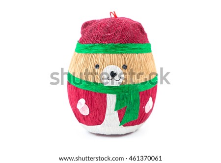 Cartoon kraft paper Christmas tree toy bear isolated on white background with space for your text. Happy New Year. Smiling brown bear wears clothes of Santa Claus with green scarf . Looking at camera.
