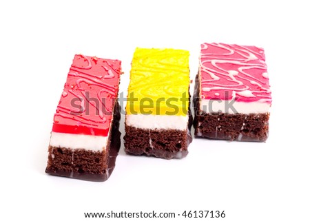 Pieces of chocolate cake are coverage varicoloured fruit jellies