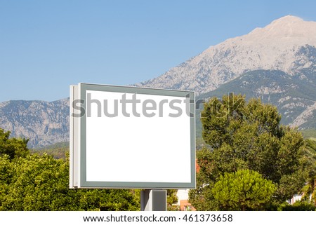 Large horizontal Billboard for advertising on a background of mountains . To insert .