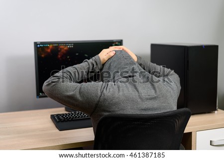 frustrated gamer playing video games - stock photo