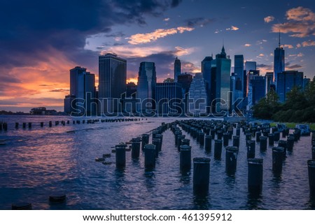 New York skyline seen from Brooklyn across the east river with some wooden pylons