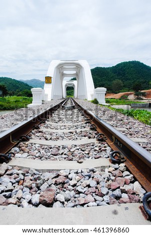 A railway bridge cross over the river in Lampoon province in the north of Thailand,Thai language appeared in this picture is the date that this bridge was contributed 
