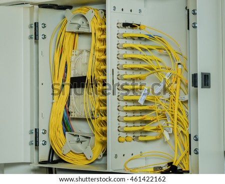 fiber optic cable connection to Network Server in a technology data center room . selective focus