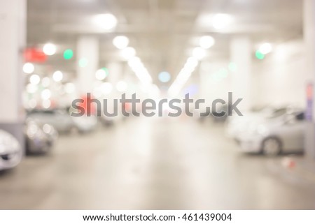 blur cars parking with bokeh light Background for use as Background.